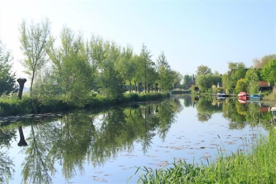 River Het Gein across the dike which is suitable for swimming in summertime