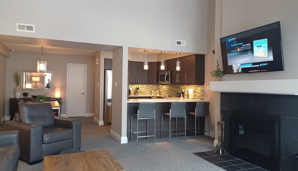 Large, spacious, open concept interior with modern rustic decor throughout.