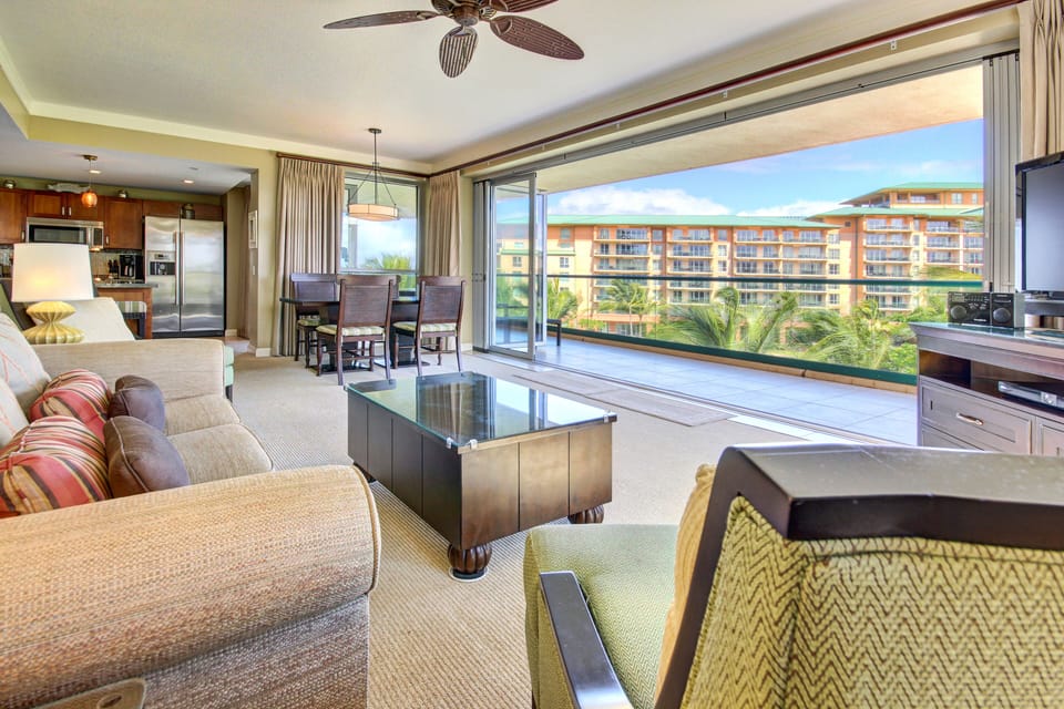 Living room view out toward ocean -- partial ocean view from living/dining room