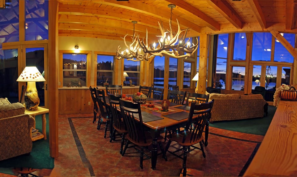 Dining Area with twin Elk Chandeliers looking out to Lake Hatcher