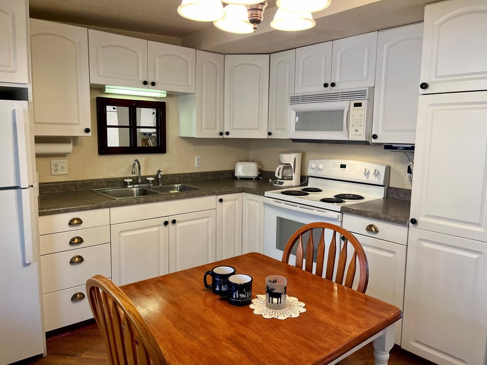 Kitchen
Picture yourself making a romantic meal for that special someone. Cottage #1 is complete with a full kitchen that includes a microwave, stove, oven, and refrigerator.
