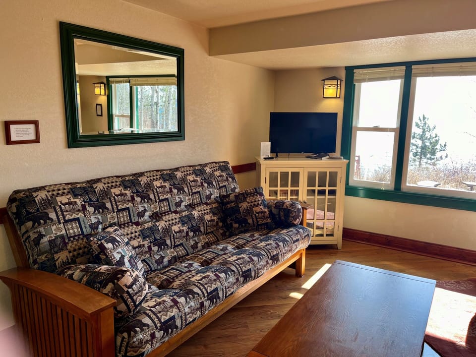 Living Area
Take a family trip to recharge. This living space enjoys a futon that folds into a full-sized bed providing enough sleeping space for the entire family.
