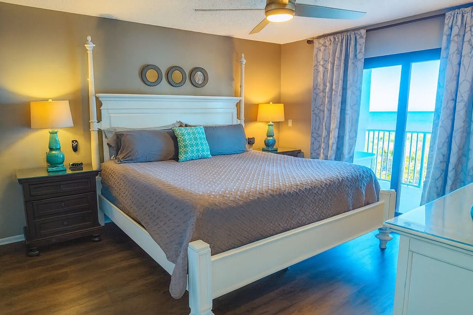 Primary king bedroom with ensuite bath, ocean views, smart tv