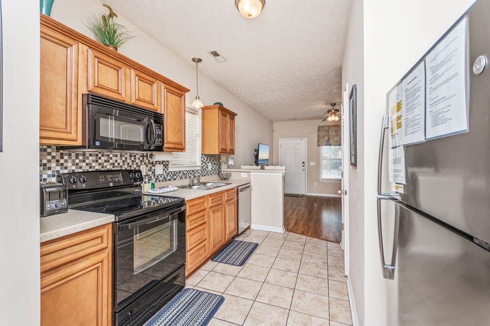 This unit is equipped with microwave, stove, dishwasher and fridge