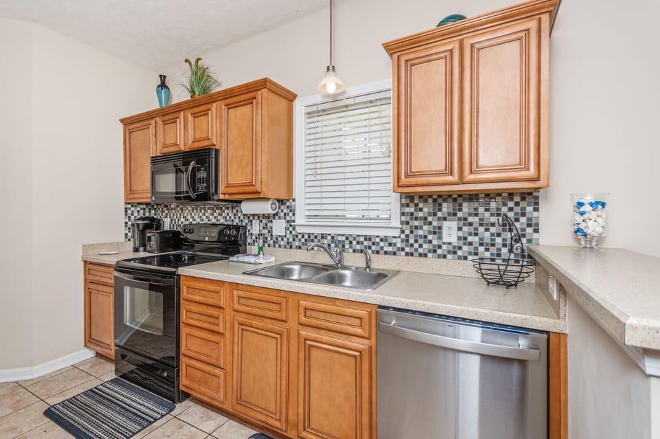This unit is equipped with microwave, stove, dishwasher and refrigerator