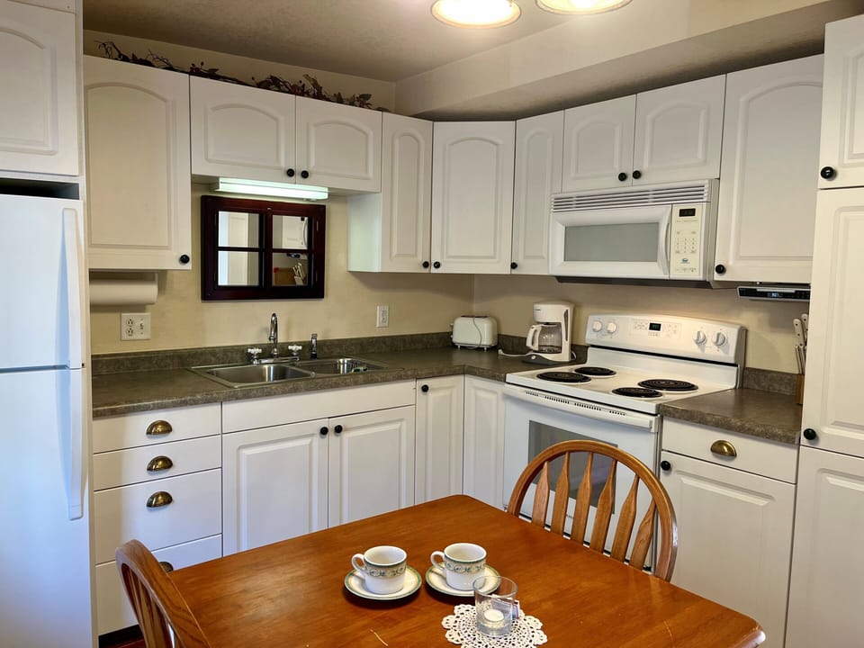 10. Kitchen
Picture yourself making a romantic meal for that special someone. Cottage #3 is complete with a full kitchen that includes a microwave, stove, oven, and refrigerator.