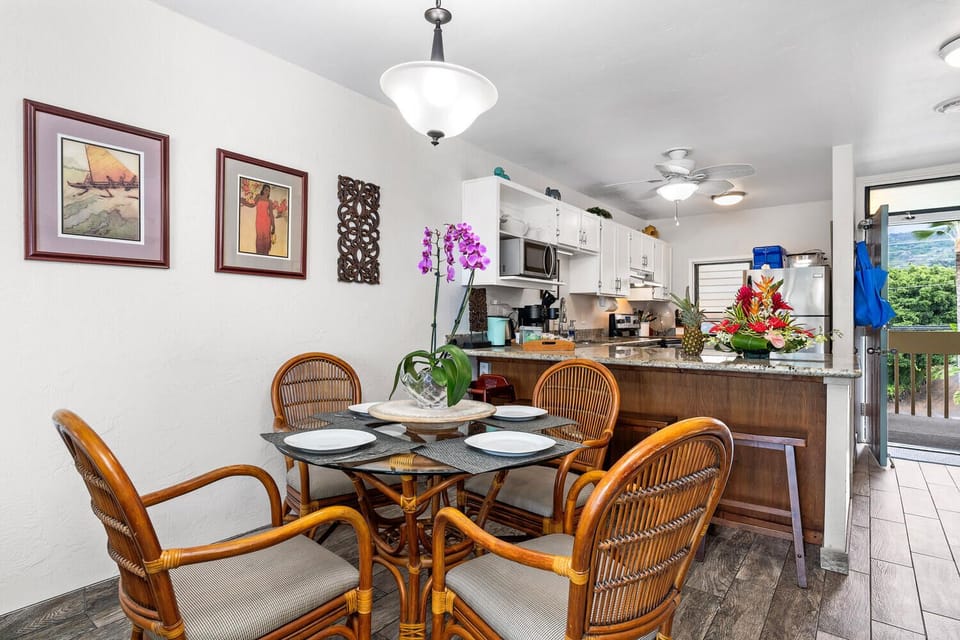 Comfortable seating for 4 plus a high chair and 3 stools at the kitchen bar.