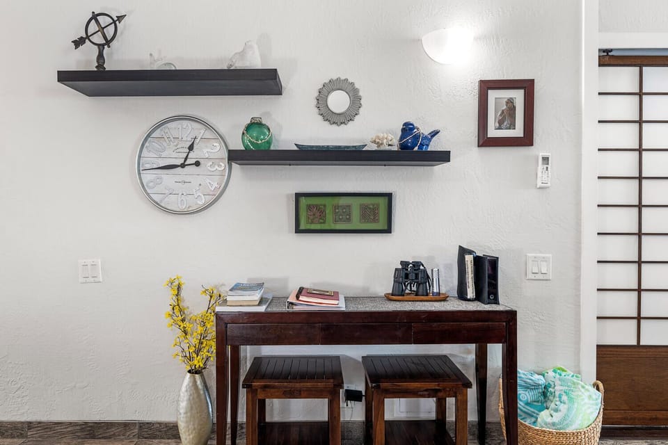 Small desk with office supplies and wireless router with 500 MBPS download speed