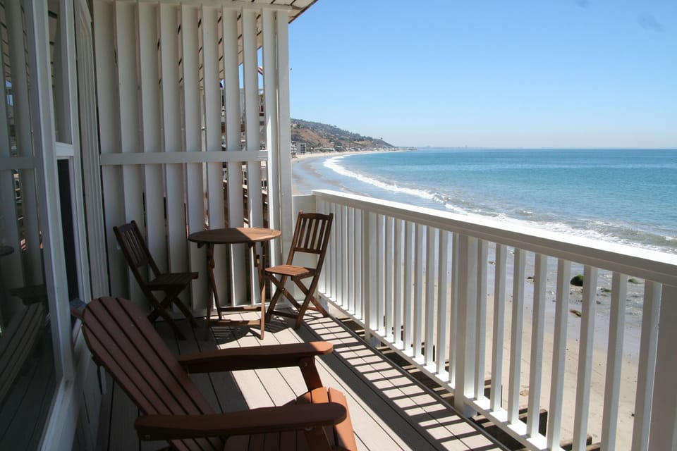 Sweeping coastline view from the deck just steps away from the beach!