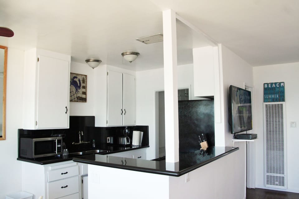 Kitchen has Granite Counters & Stainless Steel Appliances