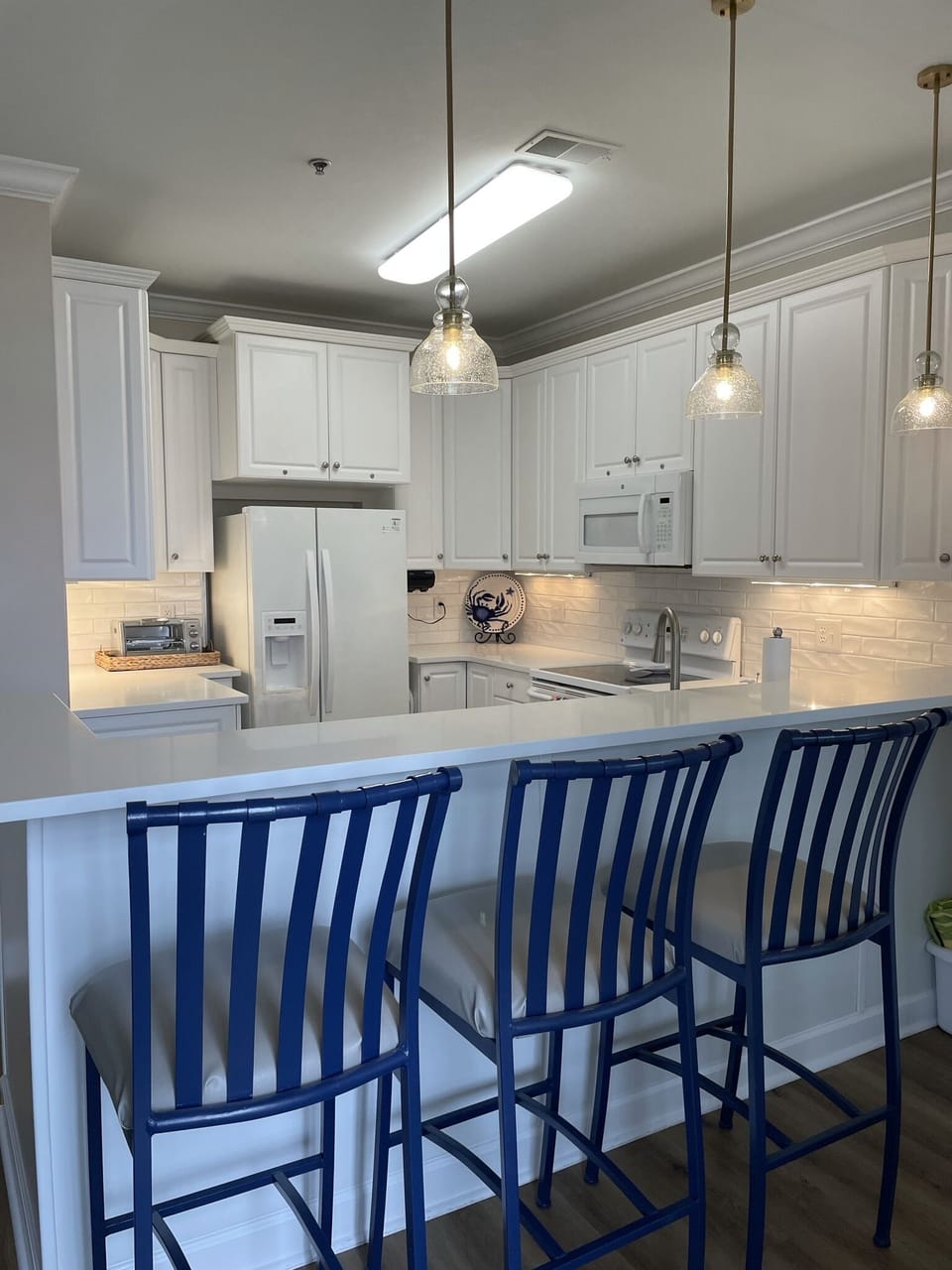 kitchen bar seating and dining area as well