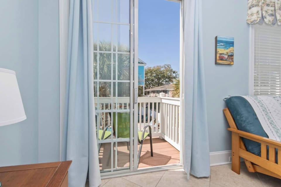 Private views, poolside perks! This main-floor bedroom offers direct access to its own balcony overlooking the pool—perfect for starting your day with a breeze and ending it with a sunset.
