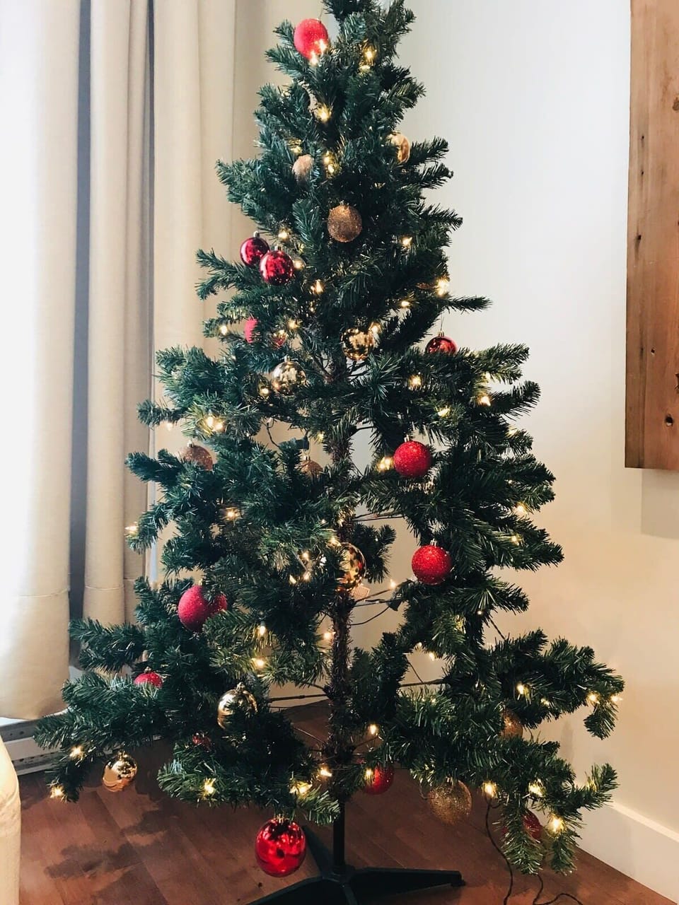 A Christmas tree is placed in the living room for a warm holiday feel ;)