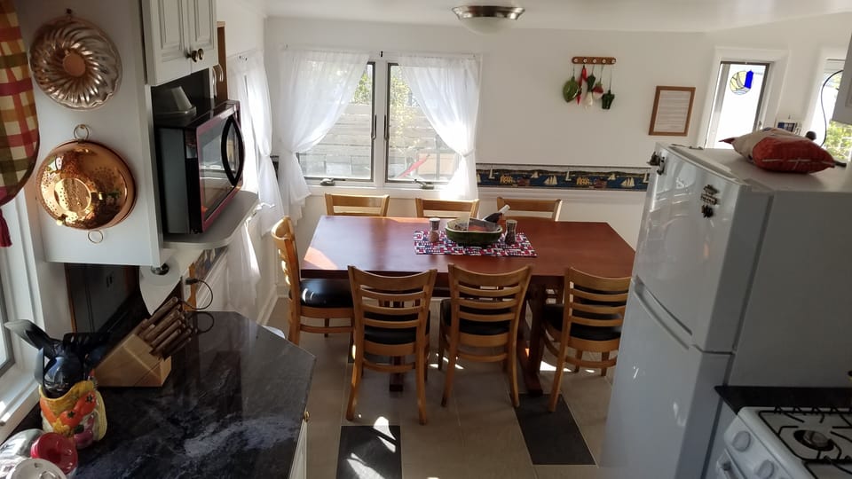 cozy kitchen with most things you'd need - toaster, blender, waffle iron!