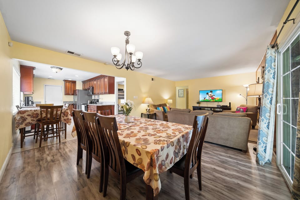 The large dining table seats 8, perfect for family meals and gathering.