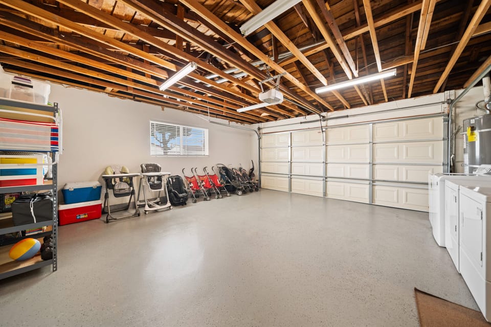 A couple of strollers,two high chairs and extra supplies in garage.