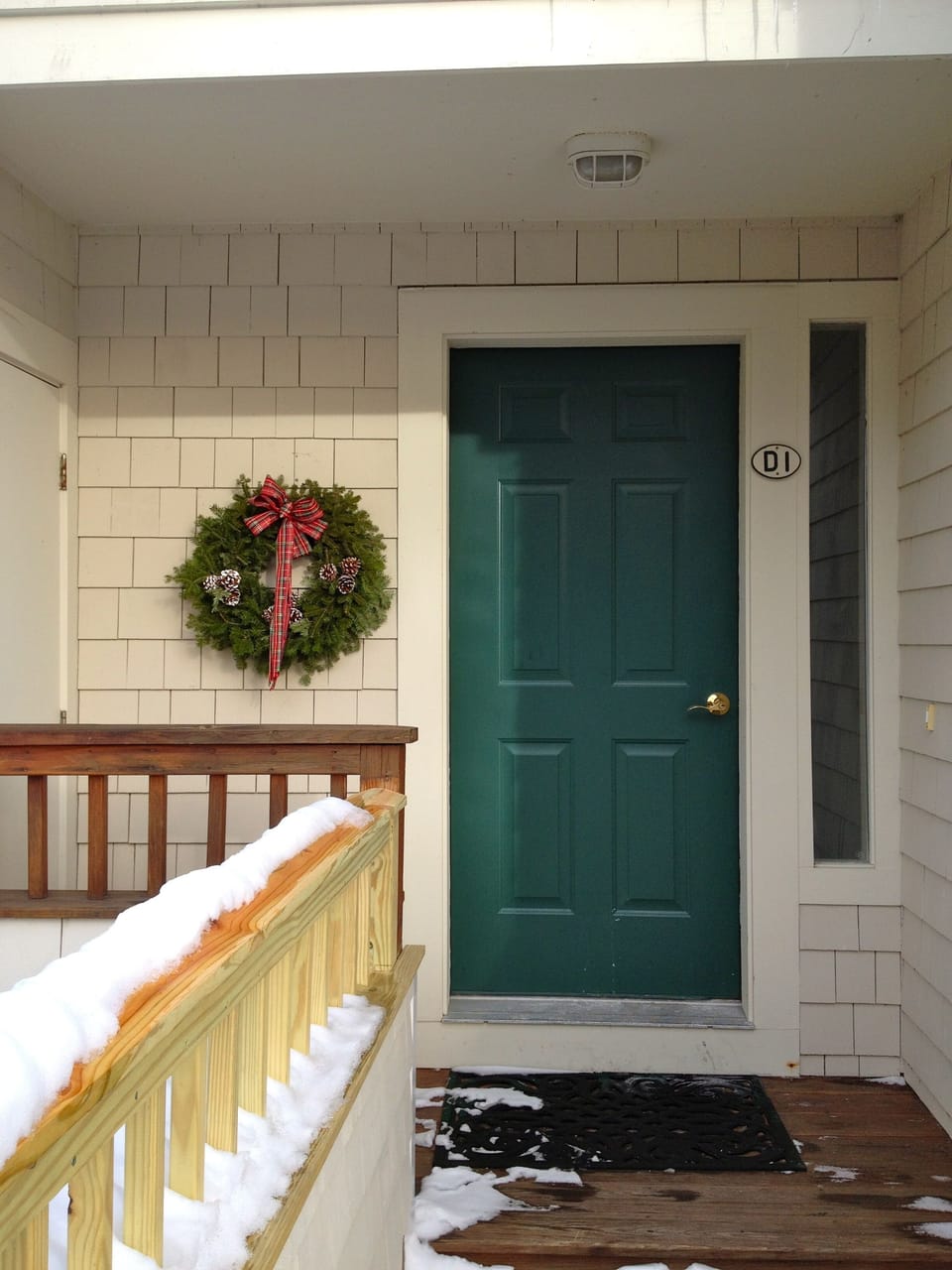 Condo entrance. Ski/storage locker to the left of the front door.