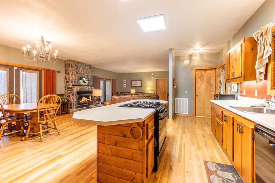 The open floor plan is perfect for gathering and/or entertaining, and the dining table expands...