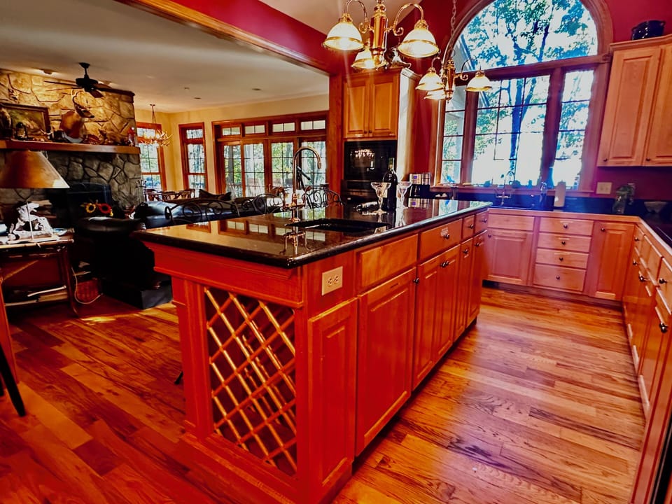 Spacious kitchen stocked with glasses, dishes, pots, pans, appliances & gadgets