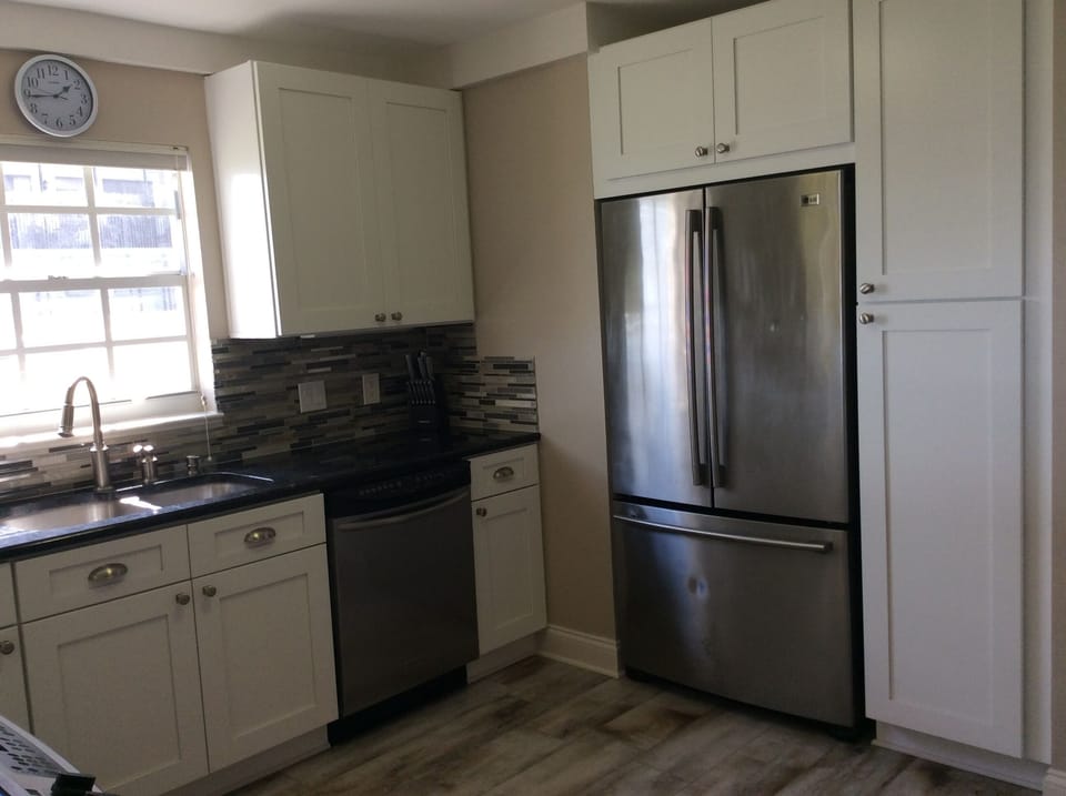 Modern kitchen with granite countertops and stainless steel 