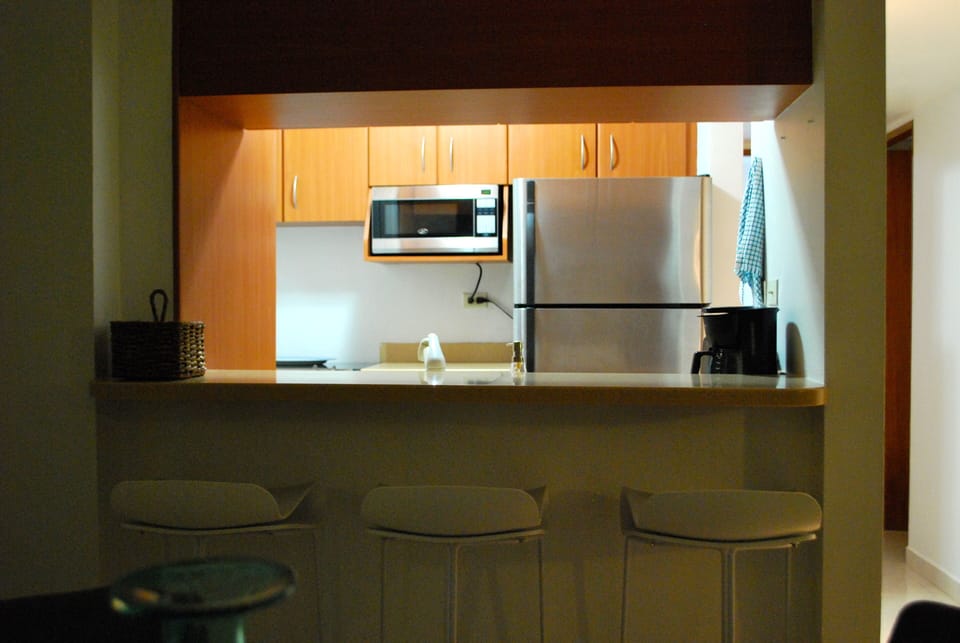 Kitchen has SS appliances, full range and washer/dryer