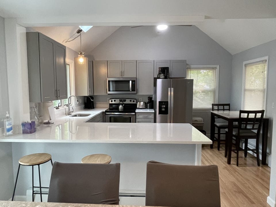 Brand new kitchen with stainless & quartz.