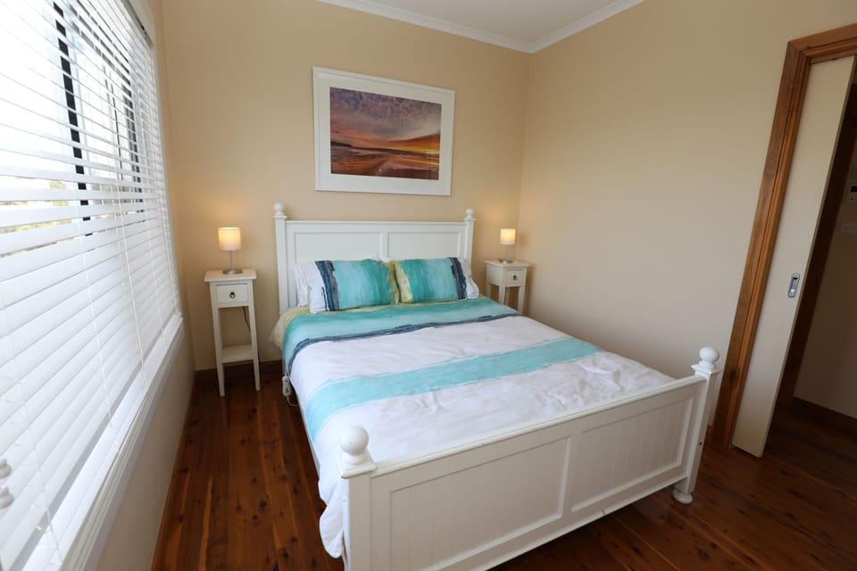 Queen bedroom #2 with closet, hanging space & suitcase rack