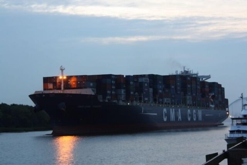 One of many cargo ships that pass by our balcony daily
