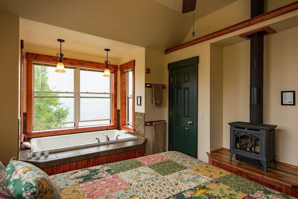 Bedroom
It doesn't get more romantic than this. Imagine laying on this comfortable bed, warming yourself by the flames of the gas stove, and looking past the spa tub for two to Lake Superior all from Inn Suite #5.