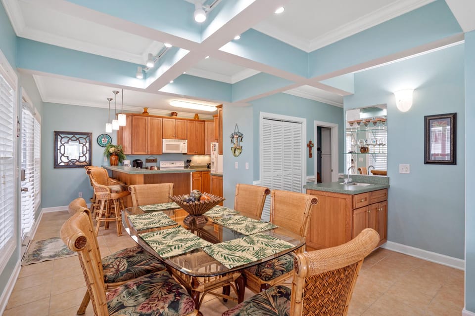 full kitchen, bar seating and dining area