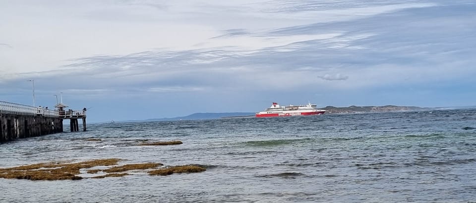 Fishermen watching the Spirit go through the Heads