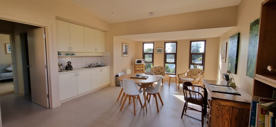 Kitchenette with dining table and extra seating.