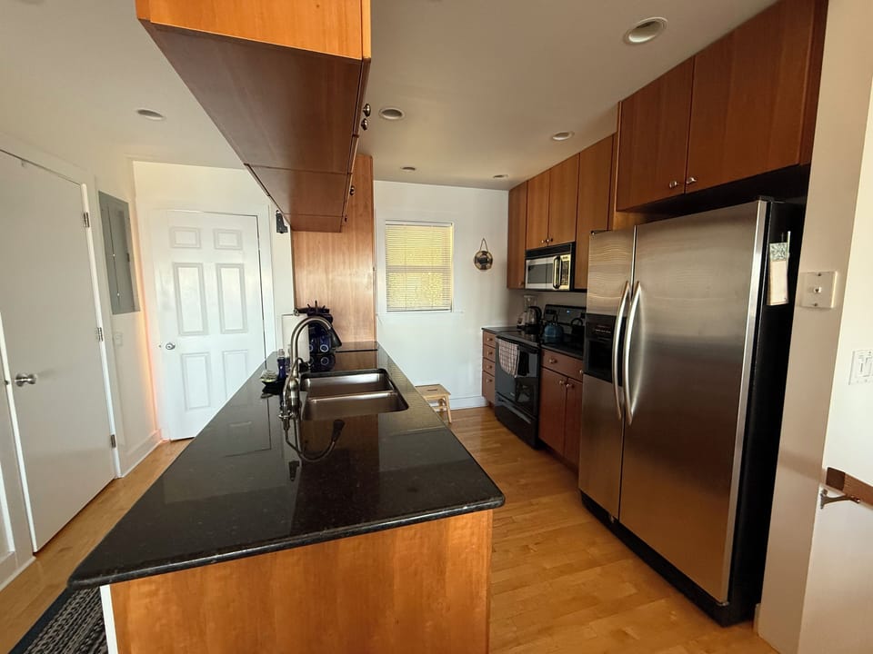 Front entry way, half bath/laundry, kitchen