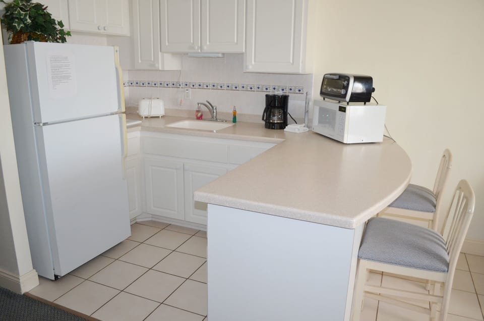 Fully furnished kitchen with two bar stools