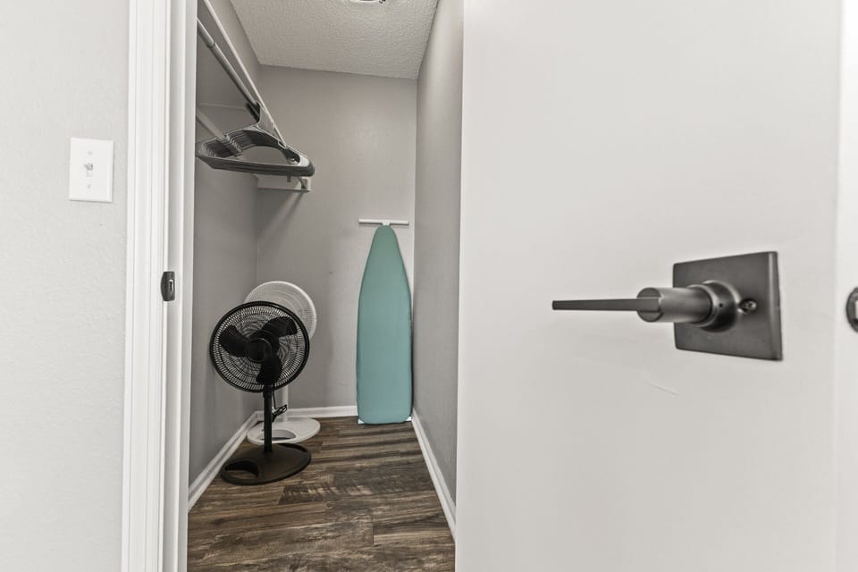 Bedroom 1 - Walk-in Closet - Oscillating Fans & Ironing board