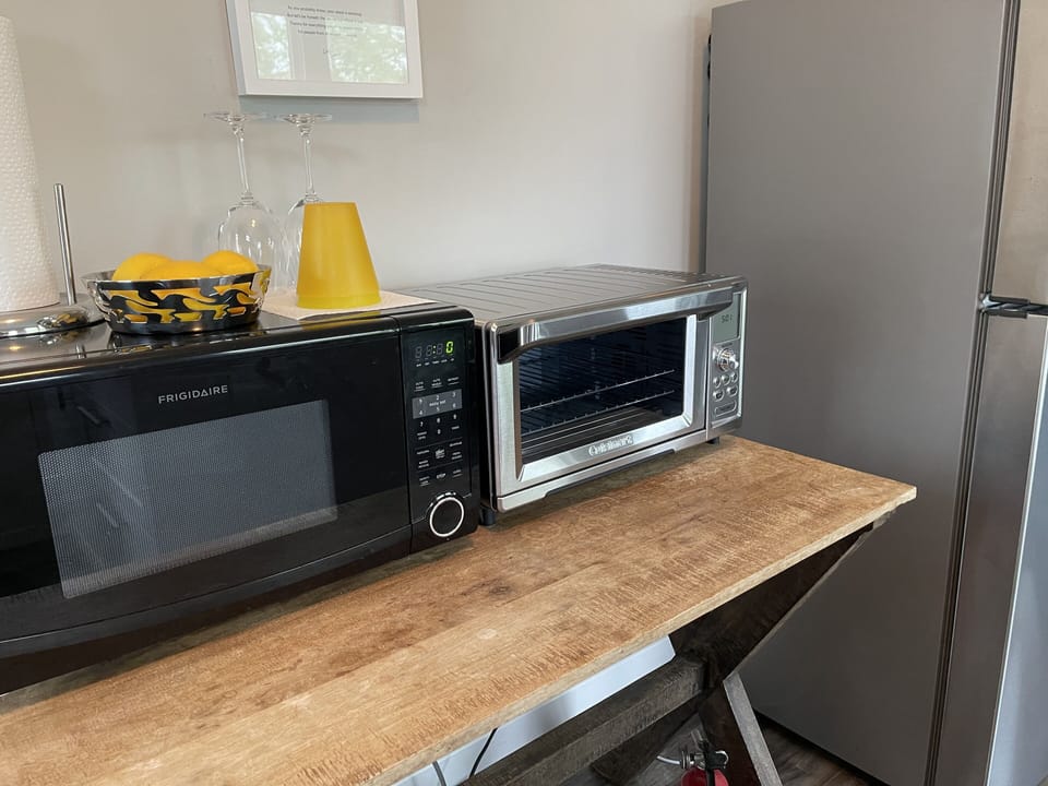 Microwave and toaster oven (large enough for a small pizza). 