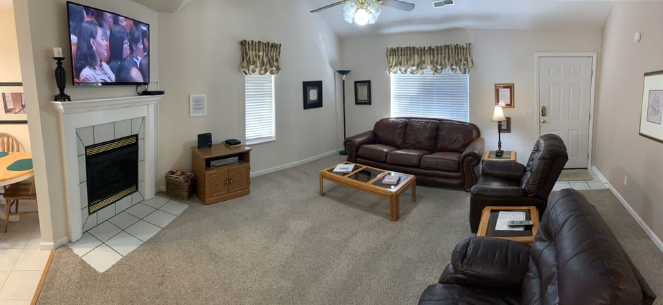 Cozy Living area with leather couch and recliners.  Gas fireplace and 48" TV