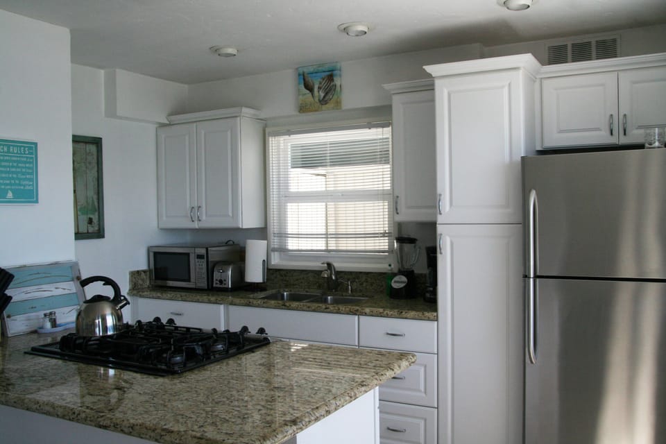 Kitchen with granite counters & stainless steel appliances