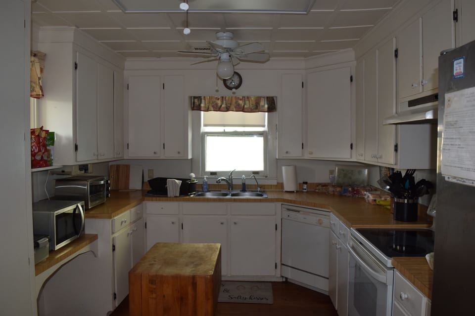 Kitchen with appliances and cooking essentials. 