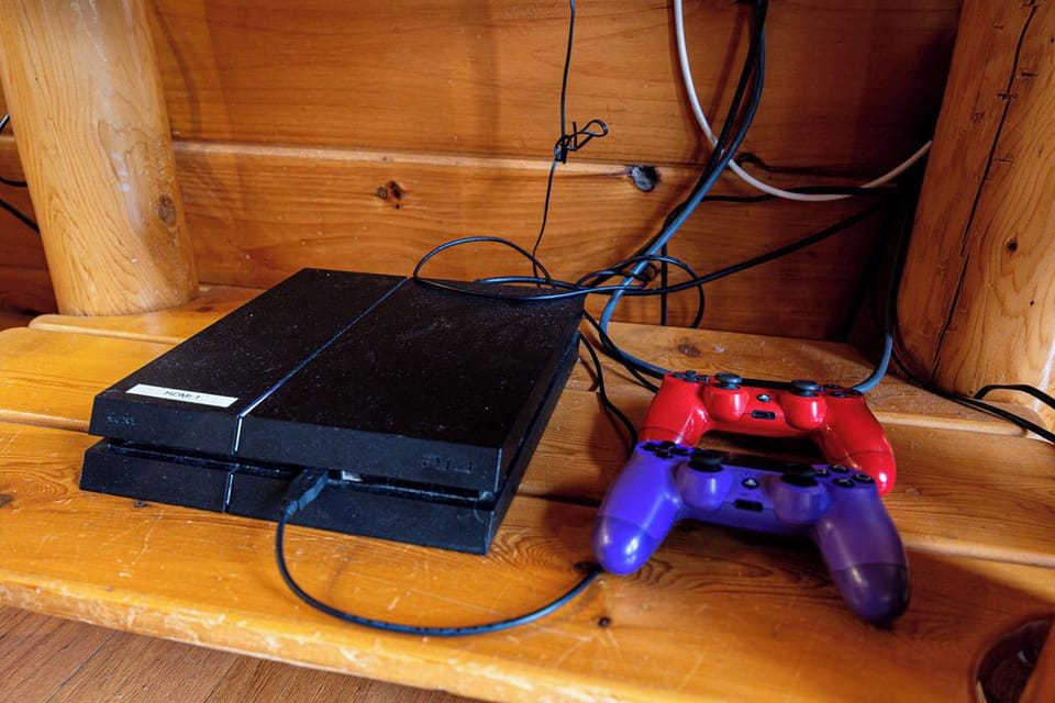 PlayStation 4 with 2 controllers and games