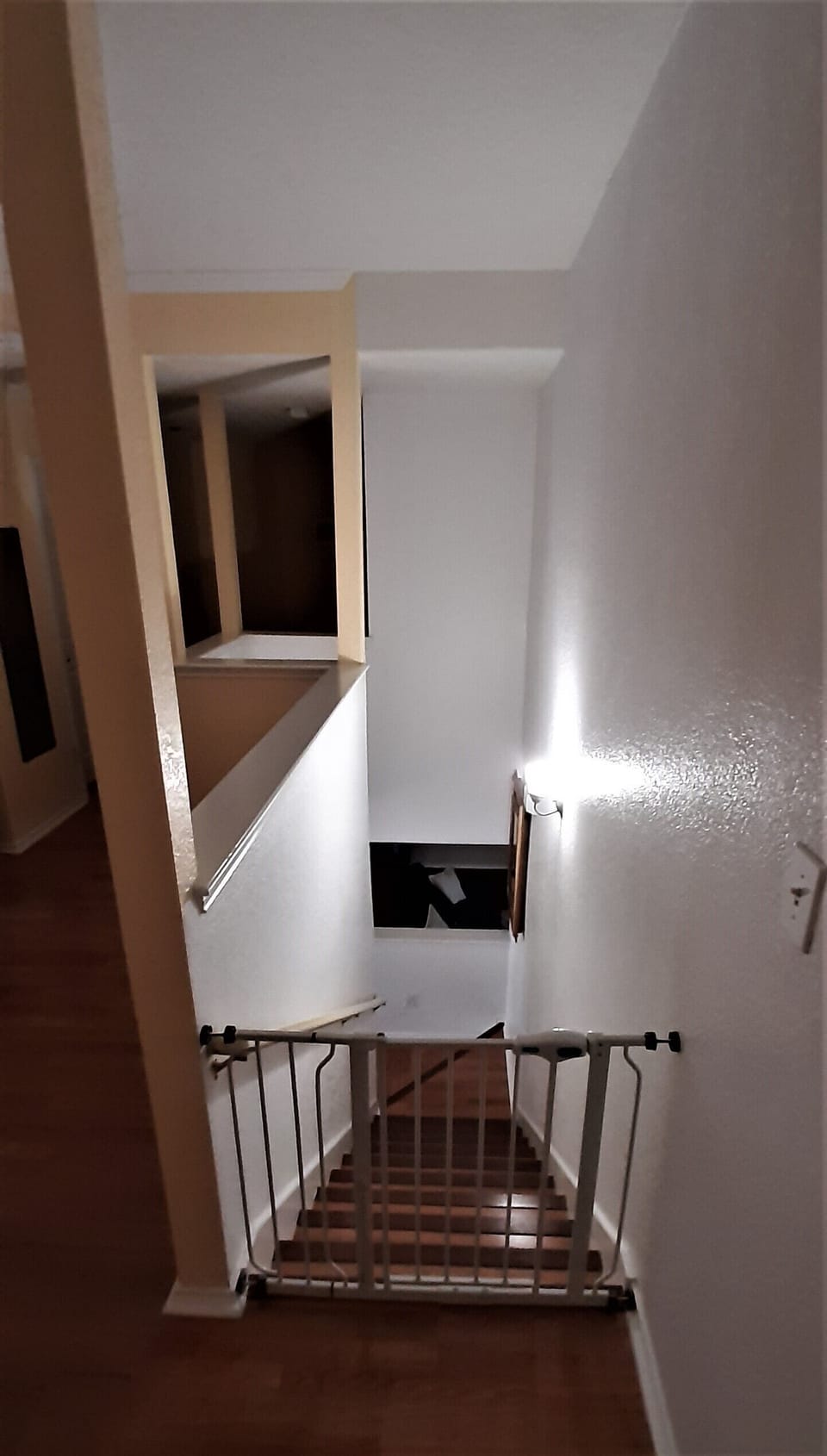 Stairs from downstairs. Stair guards are only installed upon requests of renter.