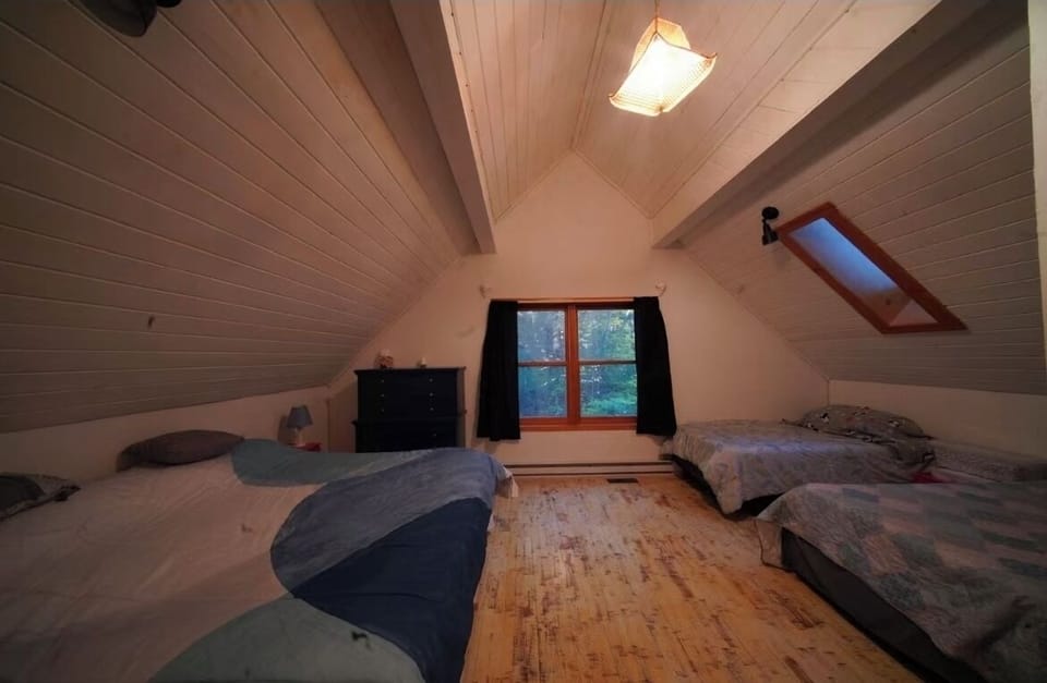 Upstairs Bedroom. King size bed and 2 singles, helpful for families with kids.