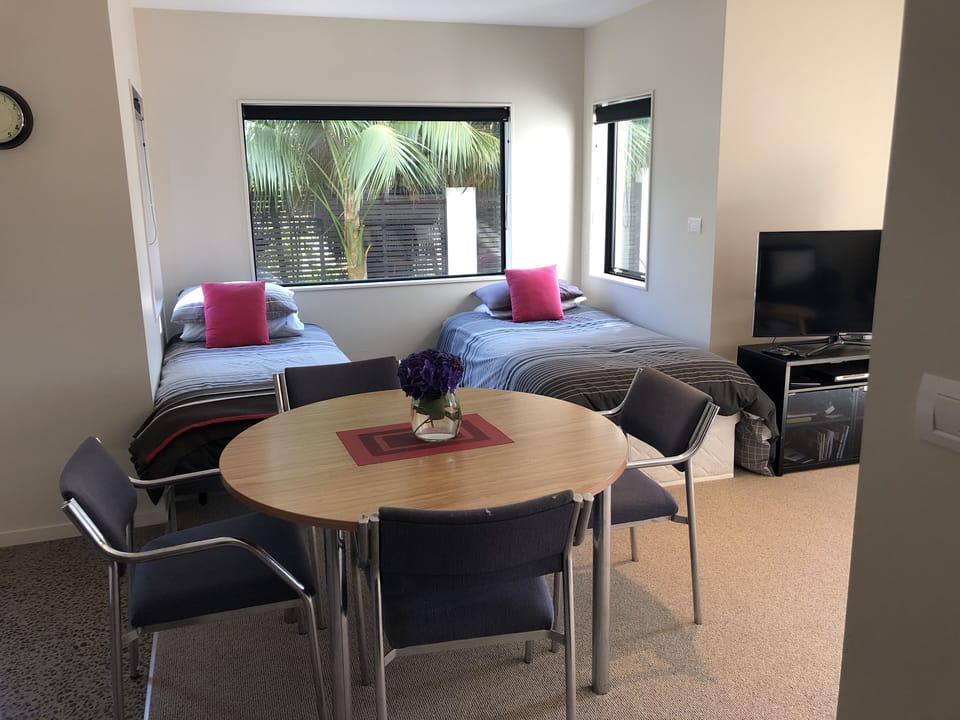 King single beds in living area.