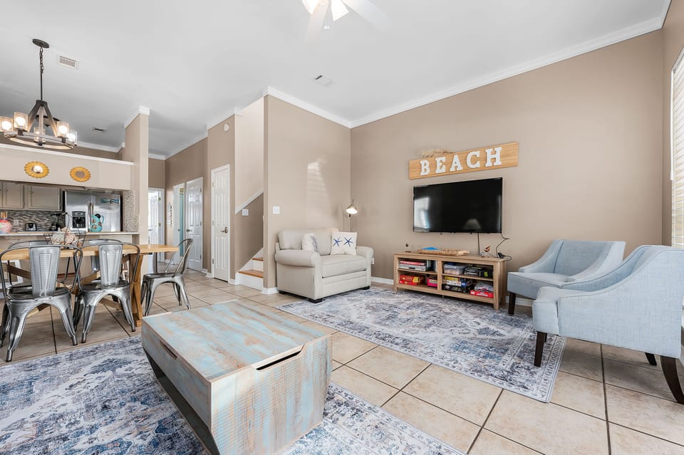Living room with sleeper sofas (queen and twin) and eat in kitchen