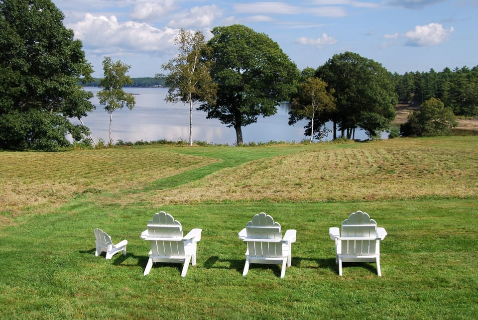 Adirondack chairs looking out to the bay