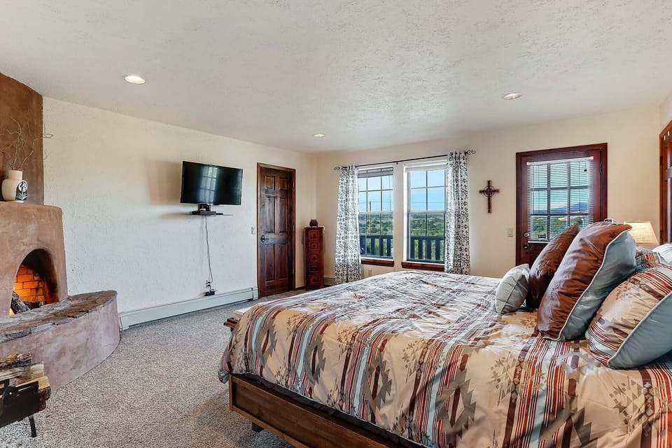 Bedroom #3 (main floor), King bed, fireplace, private bathroom and balcony. 