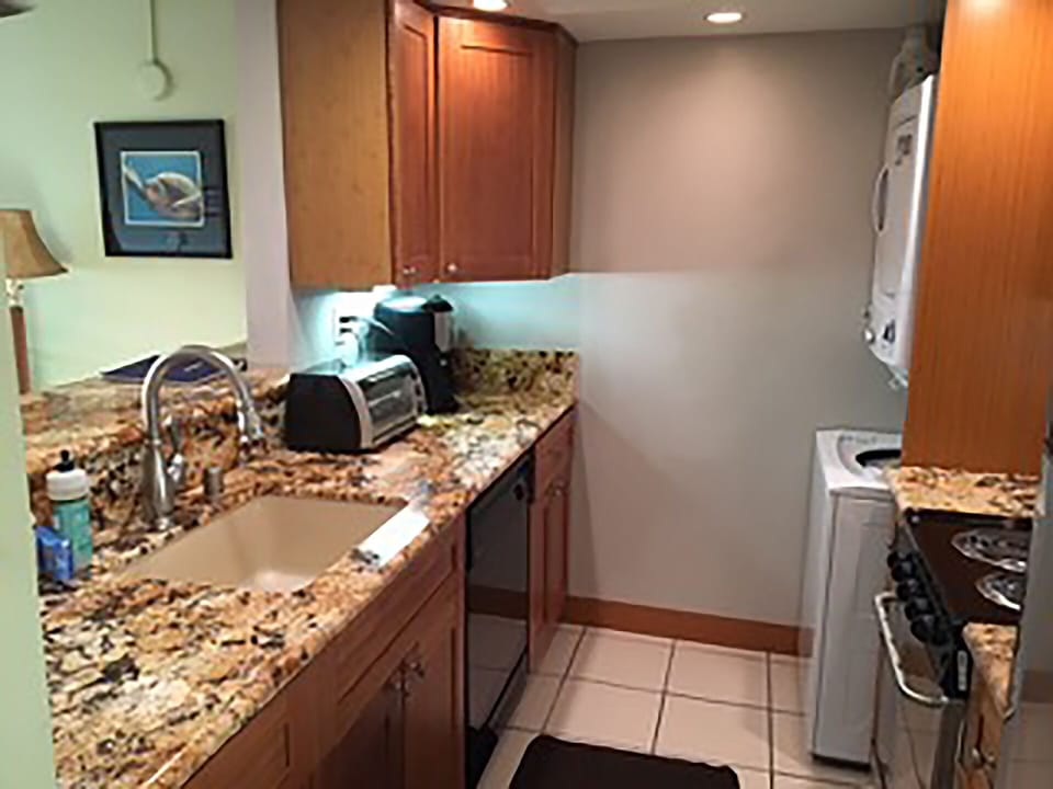 Raised bar, undermount sink granite countertops
toaster oven and coffee maker