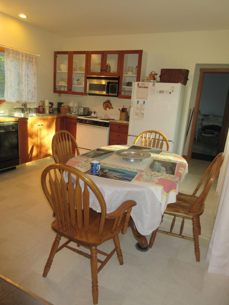 Kitchen showing Dining Table & Appliances