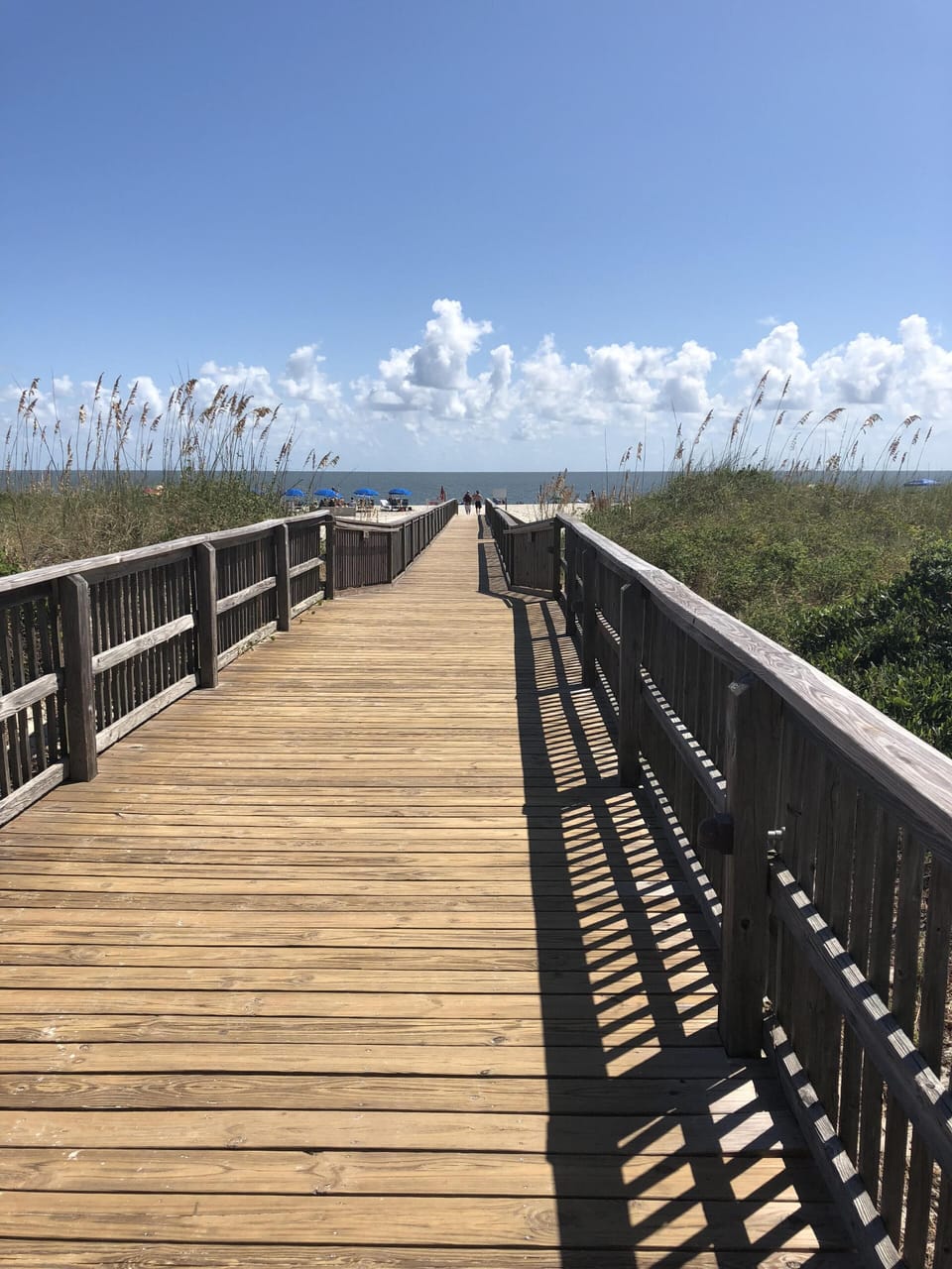 Boardwalk from resort to beach .