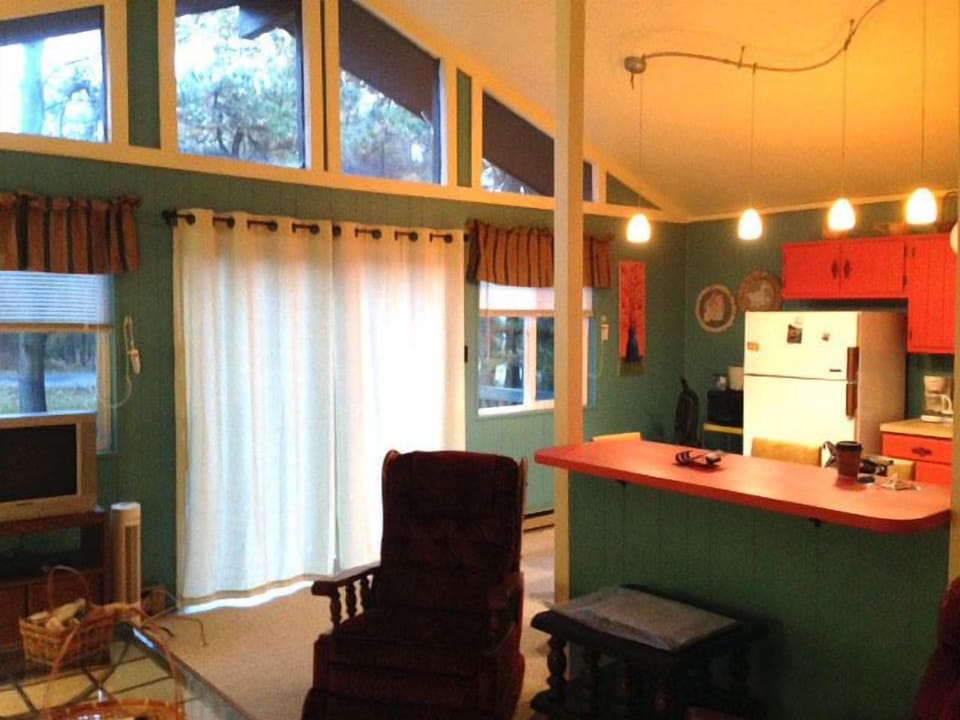 Living room view into kitchen.